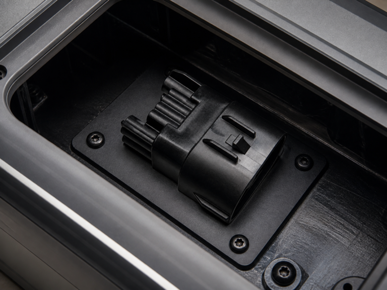 CNSJ black cable connector integrated in an e-bike battery service compartment