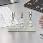 PCB designer selecting connecting pins from dimensioned header and wire-housing drawings