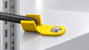 Plastic clip connector retaining a cable at an electrical enclosure entry
